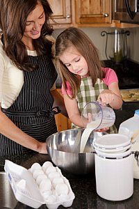girl and mom cooking